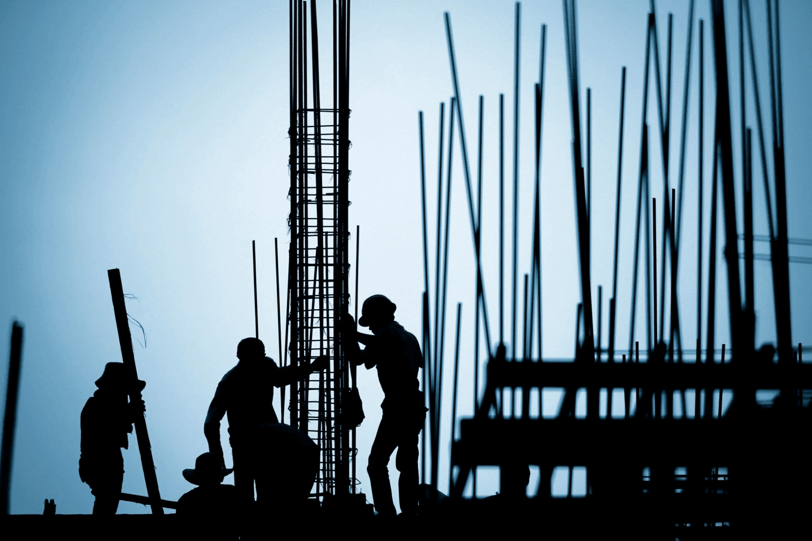A silhouette of construction worker working
